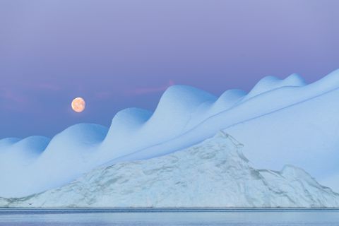 Moonrise above iceberg